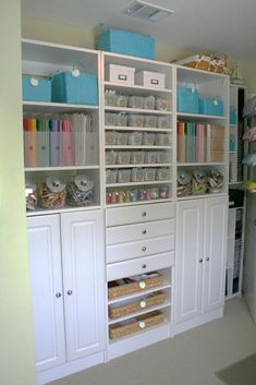 a white bookcase with lots of crafting supplies