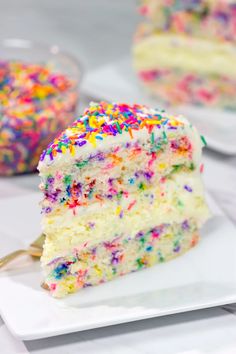 a slice of birthday cake with sprinkles on it