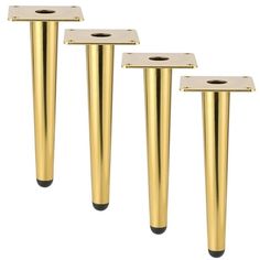 three gold colored metal poles with holes in the middle and one has a hole at the top