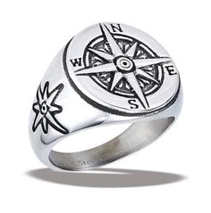 a silver ring with a compass on it