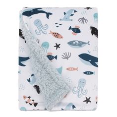 a blanket with an animal print on it and a blue, white, and black design