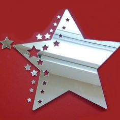 a paper cut out of a star with stars coming out of the top and bottom