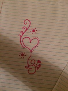 a piece of lined paper with writing on it and a heart drawn in the middle