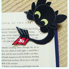 a bookmark with an image of a black cat on it