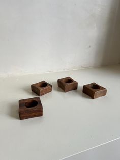 This is a set of four square-shaped Teak wood napkin rings made in Singapore in the 1960s. Solid Wood - 1.5" diameter napkin hole - Made in the 1960s Mentionable Imperfections: This is a second-hand vintage item that may show signs of use and age Wood Napkin Rings, Desk Shelf, Desk Shelves, Kitchen Decor Items, Rings Set, Dining And Kitchen, Teak Wood, Four Square, Napkin Rings