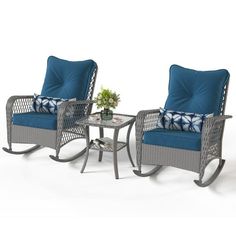 two rocking chairs with blue cushions and a small table in front of them on a white background