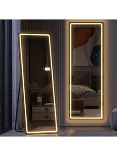 a large mirror sitting next to a bed in a room with a light on it