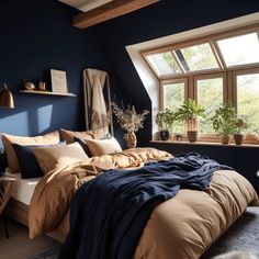 a bedroom with blue walls and tan bedding