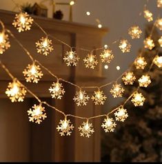 snowflake lights are hanging from a string