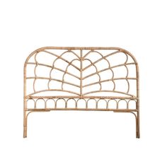 the headboard is made out of rattan and has an intricate design on it