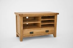 a wooden entertainment center with two drawers on one side and an open drawer on the other