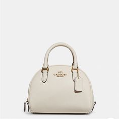 Gold /Chalk Crossgrain Leather Inside Multifunction Pocket Zip Closure, Fabric Lining Handles With 2 3/4" Drop Detachable Strap With 22 1/2" Drop For Shoulder Or Crossbody Wear 8" (L) X 6" (H) X 5" (W) Style No. Ca202 White Coach Evening Bag, White Coach Bag For Formal Occasions, Everyday White Coach Satchel, Elegant White Bag With Adjustable Strap, Coach Bag Outfit Style, White Coach Satchel For Shopping, Coach Everyday Bag With Gold-tone Hardware, Coach Satchel With Gold-tone Hardware, White Coach Satchel With Gold-tone Hardware