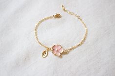 ♬ Free shipping for order USD 35 or UP. Super dainty Personalized Cherry blossom bracelet. ★ Free individual gift wrapping for all orders ★ Material - Gold plated over brass, Pearl ★ Chain Length - 5 ~ 9 inches (Please choose it from option) ★ charm measure - Flower H. 14mm x W. 13mm, Initial leaf ★ The matching necklace available https://www.etsy.com/listing/196300602/cherry-blossom-necklace-sakura-necklace ★The matching earrings available https://www.etsy.com/listing/189539614/cherry-blossoms- Bridesmaid Bracelet Flower, Cherry Blossom Bracelet, Sakura Necklace, Cherry Blossom Jewelry, Cherry Blossom Necklace, Blossom Bracelet, Flower Girl Jewelry, Flower Girl Bracelets, Bracelet Flower