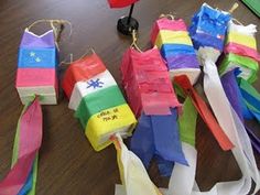 many different colored kites are on the table