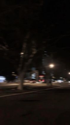 a blurry photo of a street at night