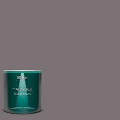 a can of marjoiee paint on a gray background