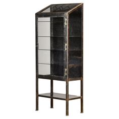 a black and white display cabinet with glass doors on the bottom, two shelves below