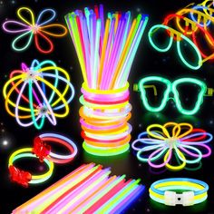 glow sticks, glasses and bracelets on a black background