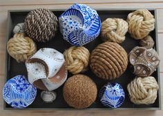 a box filled with lots of different types of balls and baskets on top of a wooden table