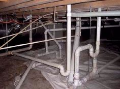 pipes and piping in the floor of a room with exposed wires on it's sides