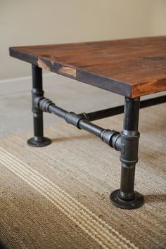 a table made out of pipes and wood with the words diycozyhome com on it