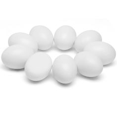 white plastic eggs are arranged in a circle