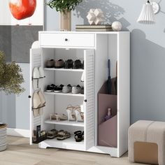 a white shoe cabinet with open doors and shoes on the bottom shelf next to it