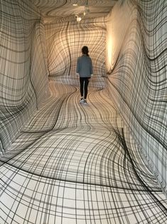 an instagram page with a woman walking through a tunnel in the middle of it