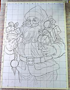 a drawing of santa holding presents on a piece of paper