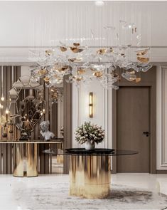 a large chandelier hanging from the ceiling in a room with marble floors and walls