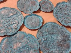 some very pretty blue metal discs on a table