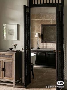 an open door leading to a bathroom with a sink