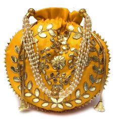 PRICES MAY VARY. Dimension :( H*L: 23*24 CM) H*L:9*9.5 Inch) Closure Type: Drawstring Color : Yellow & Golden & Multicolored Size :Small Regular Material : Embroidered silk This Potli Bag Having Beautiful Handle Made with High Quality Pearls which Look Awesome And Easy to Carry Potli Bag You can easily carry big mobile phone, valuables items, cosmetics, etc. as this potli having spacious compartment. Please kind to be note that as the product is handcrafted, there may be Gotta Patti variation in Embroidered Clutch Purse, Gota Patti Work, Pouch Drawstring, Braided Rag Rugs, Potli Bag, Embroidered Clutch, Bag Jewelry, Return Gift, Potli Bags