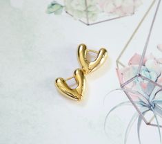 These chunky heart hoops in gold are perfect for those who wants to make a statement with their jewelry while still keeping it simple and minimalist style. chunky heart hoop earrings gold thick heart hoops bold hoops large heart hoops statement earrings valentines day gift for her earrings *Hoop size:19mm x 18mm (6mm thick)                     *Comes with a cute little gift box *Material: 18k gold plated (high quality) *See other earrings here: https://www.etsy.com/shop/DearMia?ref=seller-platfo Chunky Heart Earrings, Chunky Huggie Earrings Gift, Heart Hoop Earrings, Large Heart, Hoop Earrings Gold, Old Money Style, Earrings Hoop, Valentines Day Gifts For Her, Earrings Minimalist