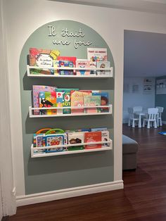 the children's bookshelf is decorated with white shelves