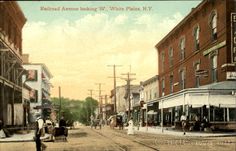 an old postcard shows people walking down the street