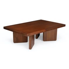 a wooden table sitting on top of a white floor