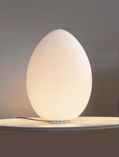 an egg lamp sitting on top of a table