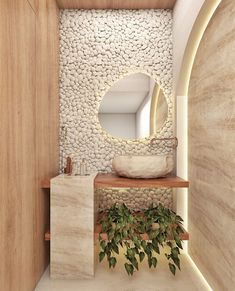 a white sink sitting under a round mirror next to a wooden shelf filled with plants