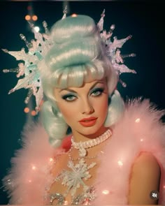 a close up of a woman wearing a tiara