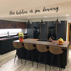 this kitchen is for dancing with three bar stools