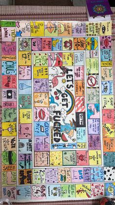 a very colorful board game with lots of words and symbols on it, as well as other items