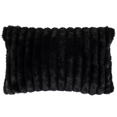 a black pillow that is made out of faux fur