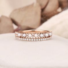 Vintage Pearl Wedding Ring Vintage Moissanite Wedding Band Half Eternity Band Pearl Stackable Rings Anniversary Band Promise Ring For Women ✦ Handmade, high-quality item ✦ Material: SOLID 10K/14K/18K GOLD ( can be made in yellow/white/rose gold ) ✦ Stone: Moissanite & Natural Pearl ✦ Cut: Round Shaped ✦ Moissanite Weight: About 0.112ct  ✦ Moissanite Color: DEF Color ✦ Or Moissanite by Natural Diamond: 0.112ct ✦ Color: G-H ✦ Clarity: SI-VS ✦ Band Width: Around 3.2mm LET'S CONNECT Please feel free Diamond Ring With Pearl Band, Wedding Ring With Pearl Band, Pearl Engagement Ring And Wedding Band, Pearl Wedding Band Stack, Wedding Bands With Pearls, Pearl Engagement Band, Pearl And Opal Ring, Pearl Wedding Band, Wedding Band Pave