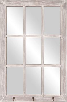 a white window frame with six mirrors on it