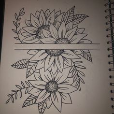 an open notebook with flowers drawn on it