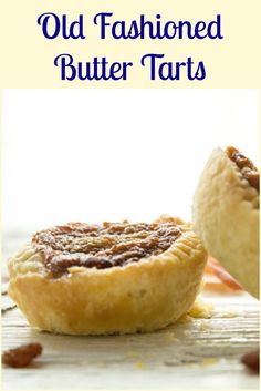 two old fashioned butter tarts on a wooden table with text overlay that reads old fashioned butter tarts