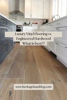 a kitchen with white cabinets and wood flooring that is featured in the article luxury vinyl floors