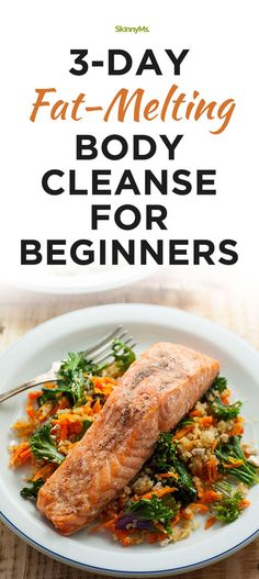 a white plate topped with salmon and vegetables