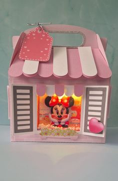 a paper doll house with minnie mouse inside